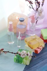 Soap, antiseptic liquid, aroma lamp with a lit candle on the windowsill, home relaxation, cleansing, body care, spa, natural cosmetics, healthy lifestyle