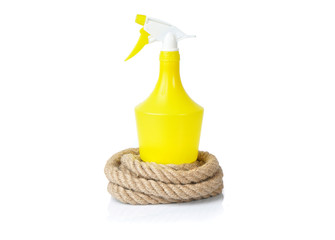 Water spray bottle and rope on a white background