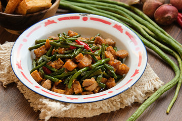 traditional indonesian food. asian culinary oseng tempe mixed with long beans