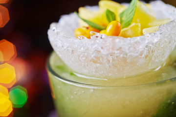 bright delicious mojito cocktail with the decor.