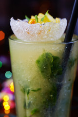 bright delicious mojito cocktail with the decor.