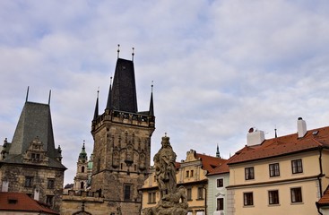Fototapeta na wymiar The Lesser Town Bridge Tower and the statues on the Charles Bridge (Prague, Czech Republic, Europe)