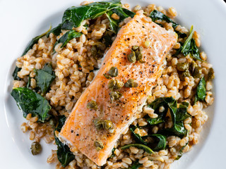 Salmon over farro and greens