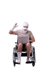 Injured man in wheel-chair isolated on white