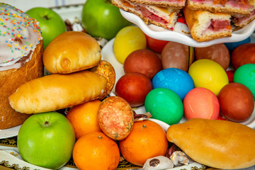 Easter Composition: Decorated Eggs, Easter Cakes and Fruits