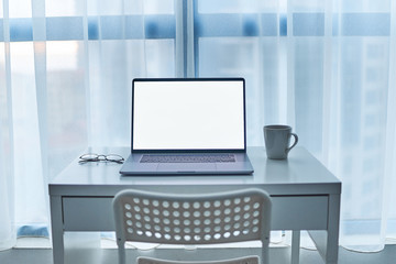 Computer desk on an empty working place. Online smart digital remote work at home. Mockup
