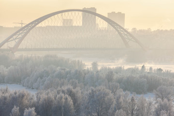 Fototapeta na wymiar Bugrinsky bridge in winter foggy morning