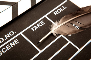 movie clapper and fountain pen closeup