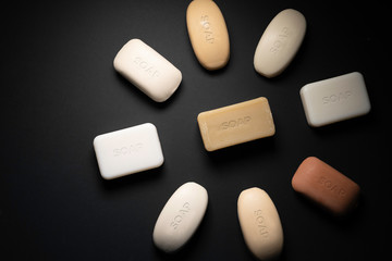 Soap bars on black background