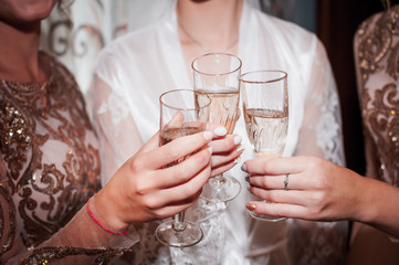 Girls clinking with glasses of champagne