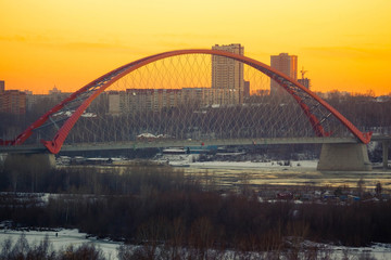 bugrinsky bridge in novosibirsk, siberia on the winter sunset