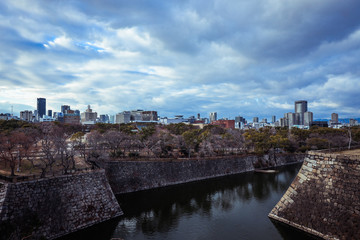 Fototapeta premium Osaka, Japan - January 07, 2020: Panoramic View to the Evening City from the Castle Roof