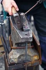 blacksmith working with hammer