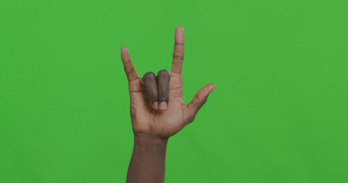 Black male hand waving with horns gesture