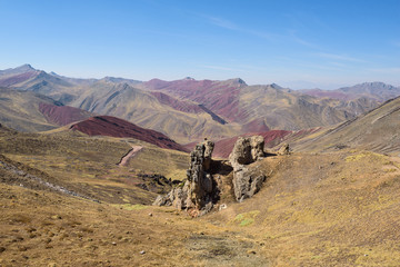 Lush green and red valleys around the Palccoyo Rainbow Mountains, Peru