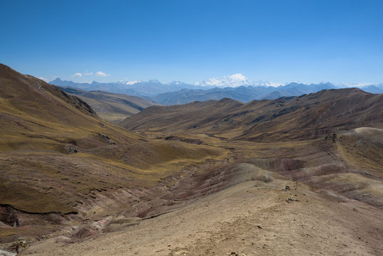 Lush green and red valleys around the Palccoyo Rainbow Mountains, Peru