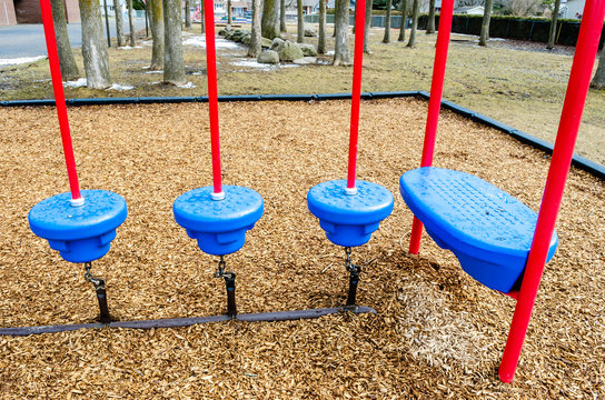 Row of playground red and blue  jumping pads