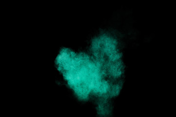 Aquamarine powder explosion on black background. Colored powder cloud. Colorful dust explode. Paint  Holi.