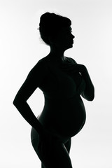 Silhouette of a pregnant girl
