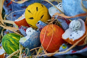 bright and coloured easter eggs  painted by hands with a lot of coloured and little quail eggs 