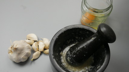 Preparation aioli with garlic and oil, march 2020