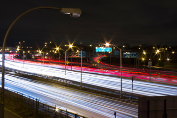 Car Lights on Road, Long Exposure of American Road. Light trails on Highway in New York, Queens.