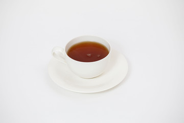 white cup with tea on a white background