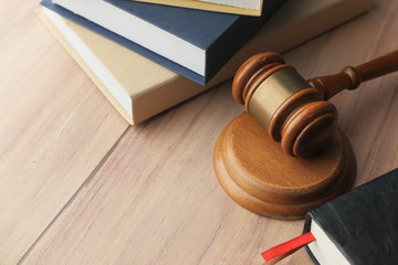Close up of gavel, book and handcuff on table 