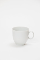 white cup for tea or coffee on a white background