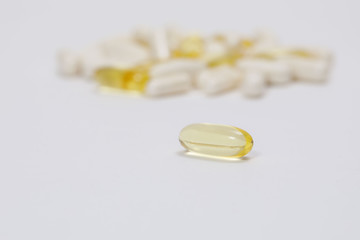 pills and vitamins on a white background