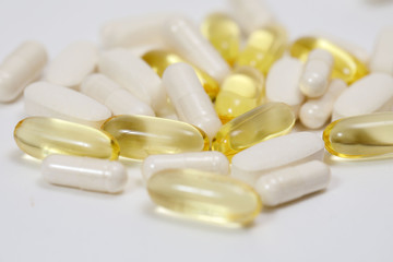 pills and vitamins on a white background