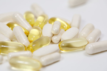 pills and vitamins on a white background