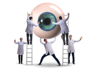 Doctor examining giant eye in medical concept