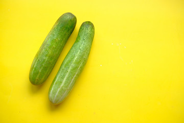 Two cucumbers on an isolated white background