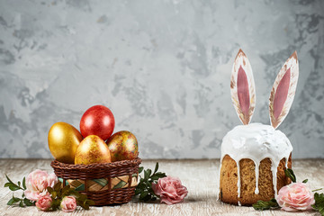Easter pastries and colored eggs on a textured  background. Spring composition. Traditional pastries for Orthodox holidays.