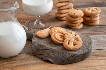 Butter cookies with jug of milk