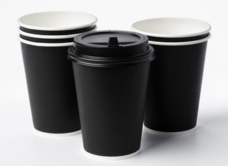 Paper coffee cups isolated on white background. Close up.