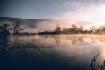 Mystical lake on a foggy morning