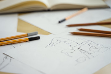 How to draw class of many figure drawing pencil and marker sketches. The artist worskspace with male and female drawings and pencils on the white paper, art, craft, creativity, inspiration, concepts