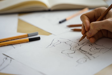 How to draw class of many figure drawing pencil and marker sketches. The artist worskspace with male and female drawings and pencils on the white paper, art, craft, creativity, inspiration, concepts