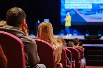 Audience listens lecturer at workshop