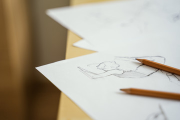 How to draw class of many figure drawing pencil and marker sketches. The artist worskspace with male and female drawings and pencils on the white paper, art, craft, creativity, inspiration, concepts