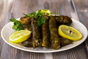 leaf wrap, vine leaf, traditional food, isolated on white, dolmades, sarmale, dolma, lemon slices, appetizer