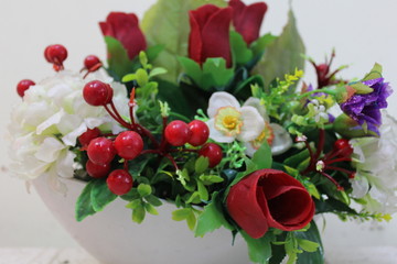 bouquet of red roses in a vase on white background