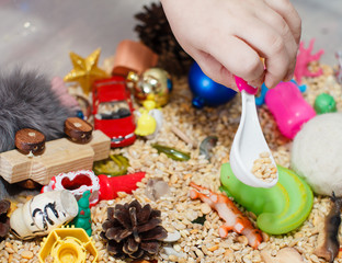 The child develops fine motor skills with the help of a sensor box. The concept of child...