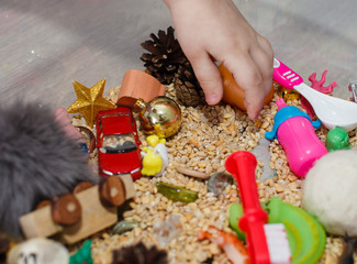 Children's pens and sensor box. Child plays with touch box