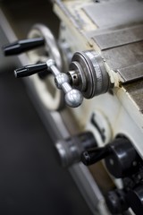 Abandoned machine metalworking lathe in a factory closing due to the pandemic virus