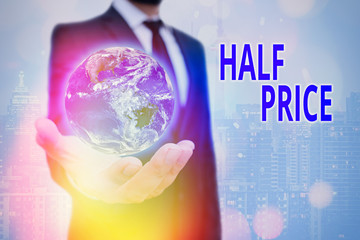 Conceptual hand writing showing Half Price. Concept meaning half the usual price at which something is offered for sale Elements of this image furnished by NASA