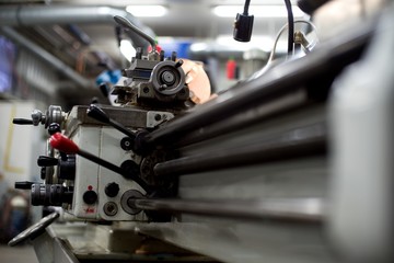 Fototapeta premium Abandoned machine metalworking lathe in a factory closing due to the pandemic virus