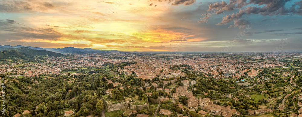 Wall mural aerial sunset panorama of bergamo in lombardia italy, with dramatic colorful sky